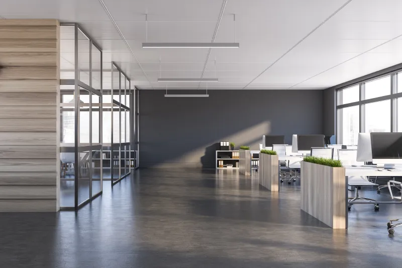 an empty office with a lot of desks and chairs