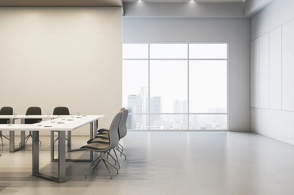 a conference room with a long table and chairs
