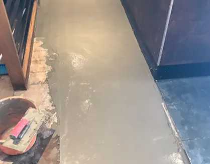 a cement floor being poured into a room